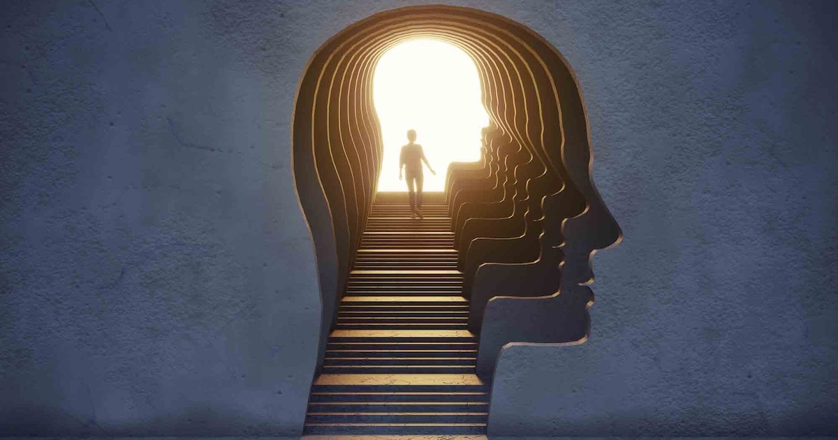 Woman standing in the gate shaped of human head
