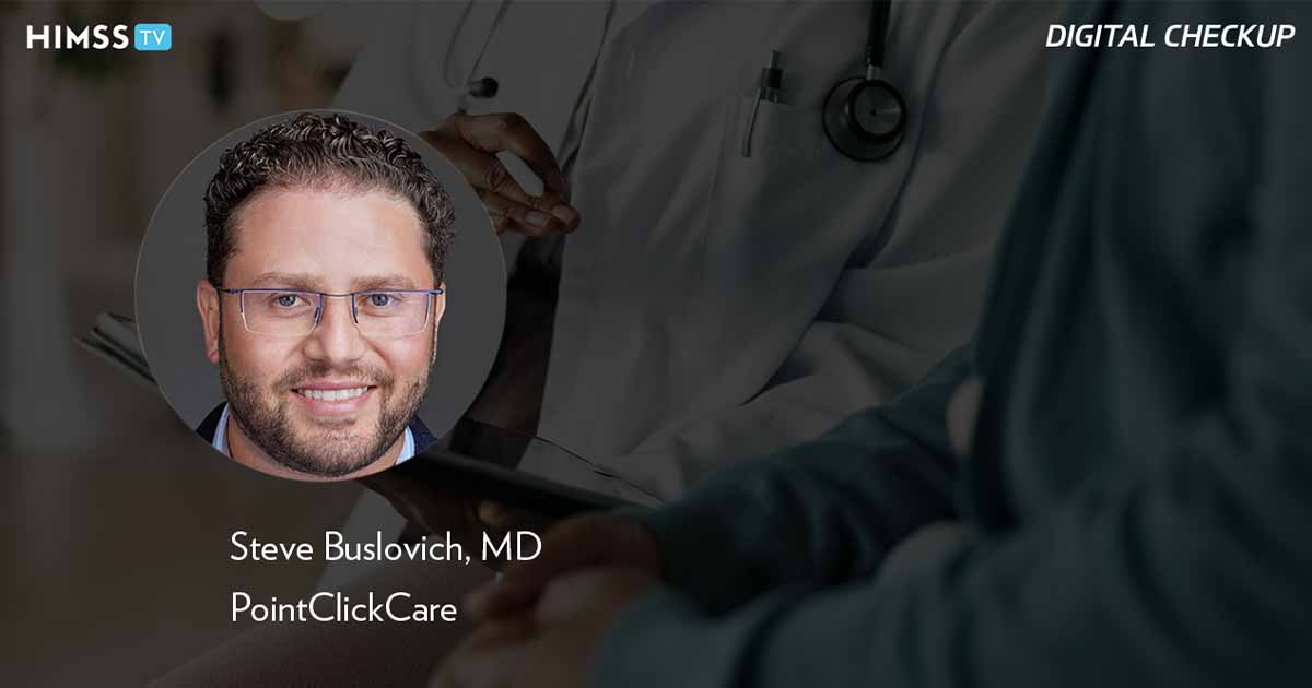 Dr. Steve Buslovich, PointClickCare_Doctor holding tablet with patient Photo by Jacob Wackerhausen/iStock/Getty Images Plus