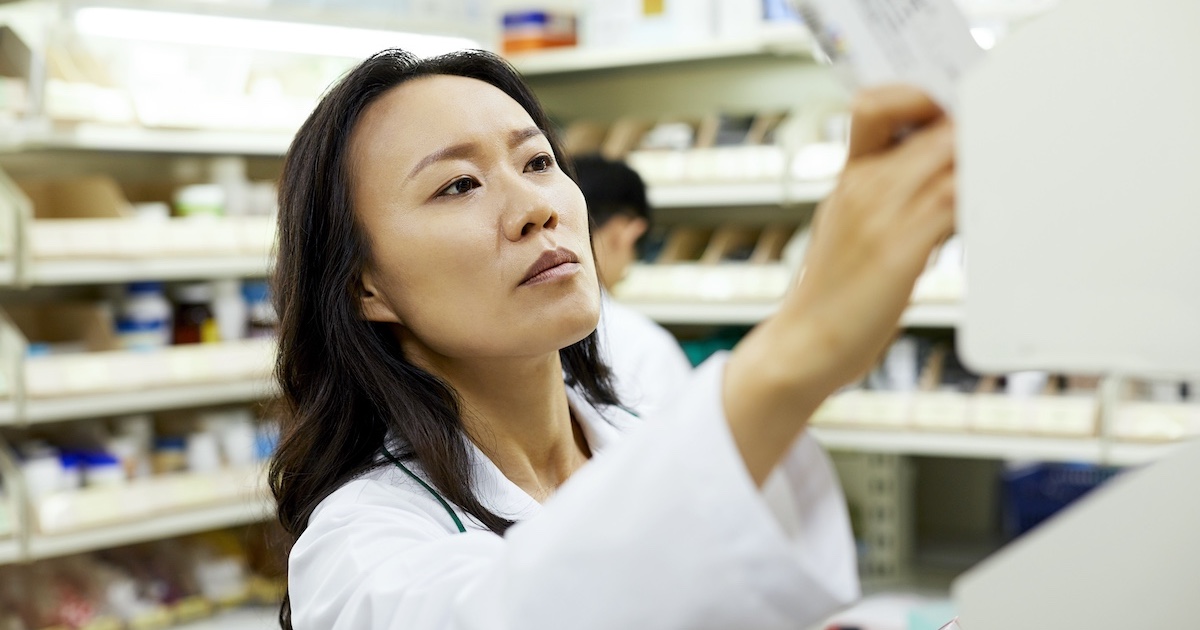 Pharmacist conducting inventory Pharmacist conducting inventory