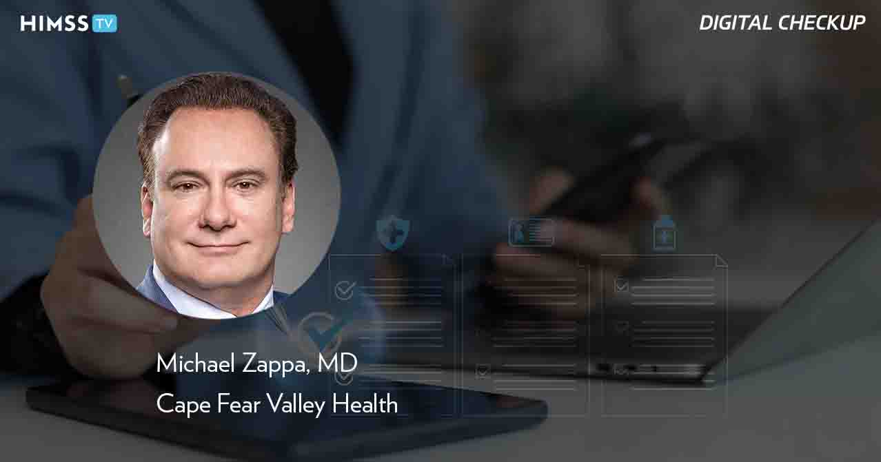 Dr. Michael Zappa, Cape Fear Valley Health_Using tablet to manage digital health checklist_Panchanut Chobjit/iStock/Getty Images Plus