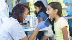Healthcare provider examining a patient Healthcare provider examining a patient