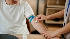Nurse drawing blood from a person