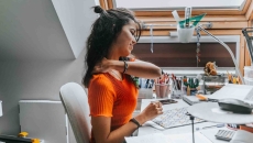 Person with neck pain sitting at a desk