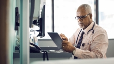 Physician using a tablet Physician using a tablet