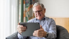 Man using a tablet PC Man using a tablet PC