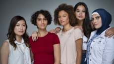 Five people standing by each other Five people standing by each other