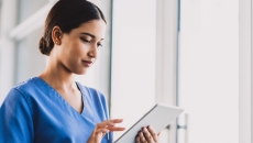 Healthcare provider on a tablet Healthcare provider on a tablet