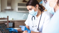 Two people looking at a tablet Two people looking at a tablet