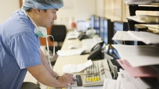A clinician using a desktop computer