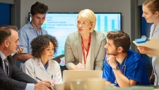 Medical personnel and executives in a conference
