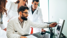 Healthcare practitioners looking at ultrasound results Healthcare practitioners looking at ultrasound results