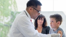 Doctor giving injection to pediatric patient Doctor giving injection to pediatric patient