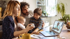 Family communicating with healthcare professional via telehealth Family communicating with healthcare professional via telehealth