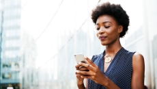 Person looking at information via a mobile app Person looking at information via a mobile app