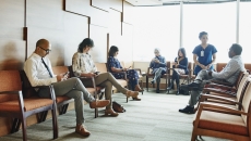 Patients sitting in a physician waiting room Patients sitting in a physician waiting room