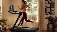A person running on a Peloton treadmill