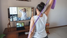 A woman doing at-home physical therapy exercises