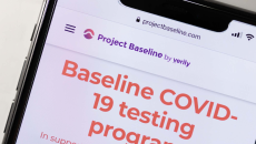 A phone showing a screenshot from Project Baseline's COVID-19 testing program.