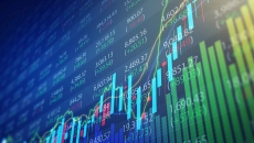 Rising stock market chart on a trading board Rising stock market chart on a trading board