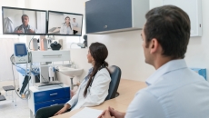 Clinicians interacting via interactive TV screens Clinicians interacting via interactive TV screens