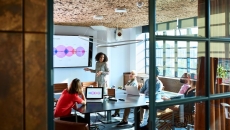 A woman presenting to investors.