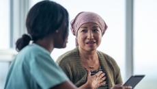 A cancer patient talking to a provider. A cancer patient talking to a provider.