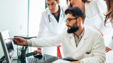 Doctors look at screen