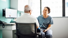 A doctor meeting with a patient. A doctor meeting with a patient.