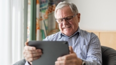 Patient looking at a smart pad Patient looking at a smart pad