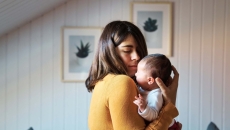 Parent holding baby Parent holding baby