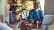A couple talking on a smartphone telehealth visit A couple talking on a smartphone telehealth visit