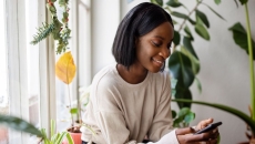 Person using a smartphone Person using a smartphone