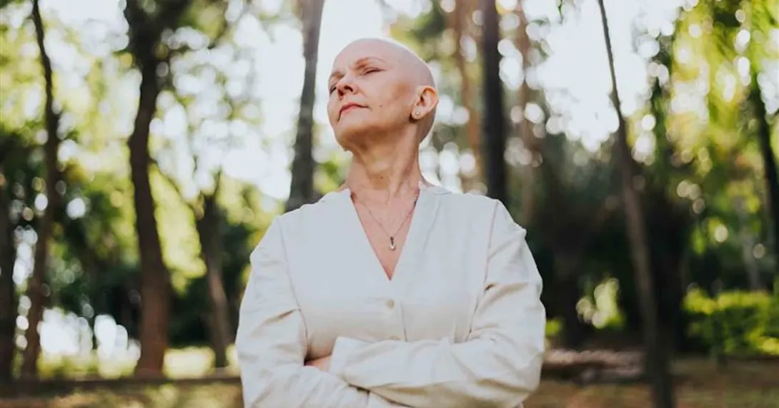Oncology patient standing in nature Oncology patient standing in nature