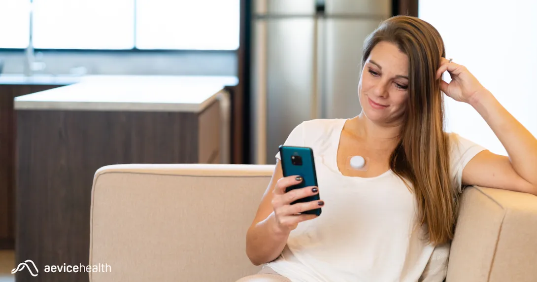 A person wearing the AeviceMD wearable stethoscope