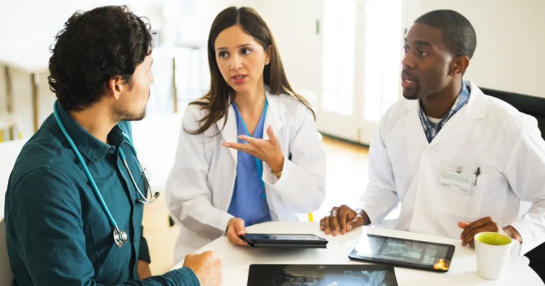 Healthcare professionals reviewing and discussing clinical data