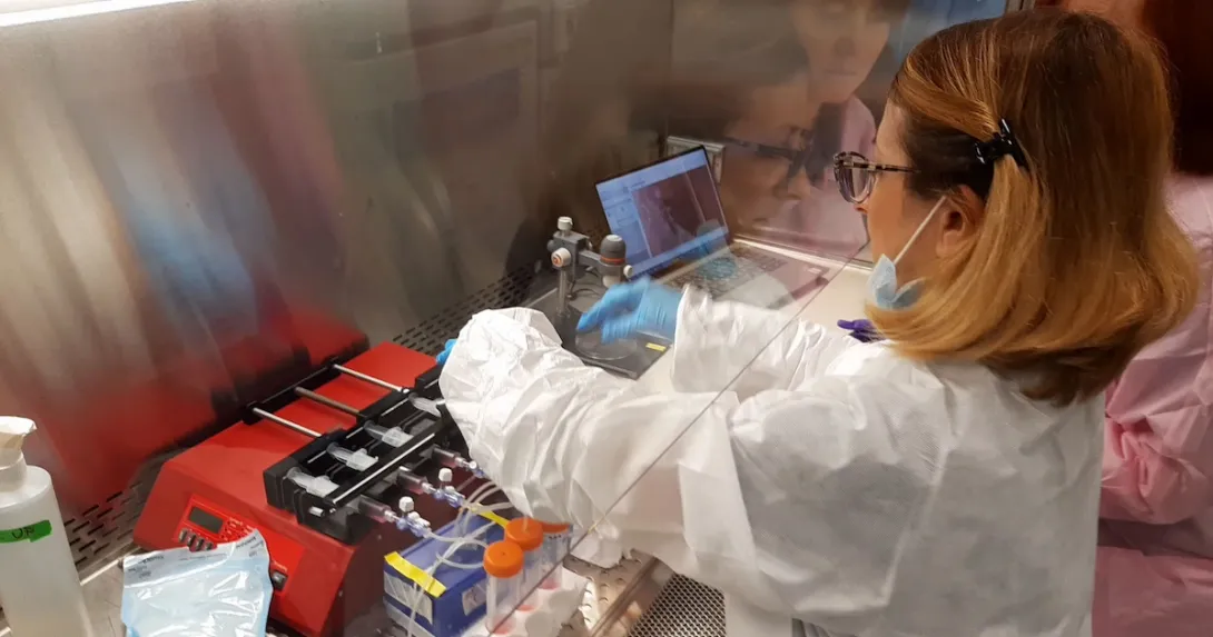 Researcher at the Kennedy Space Center preparing the programmable syringe pumps