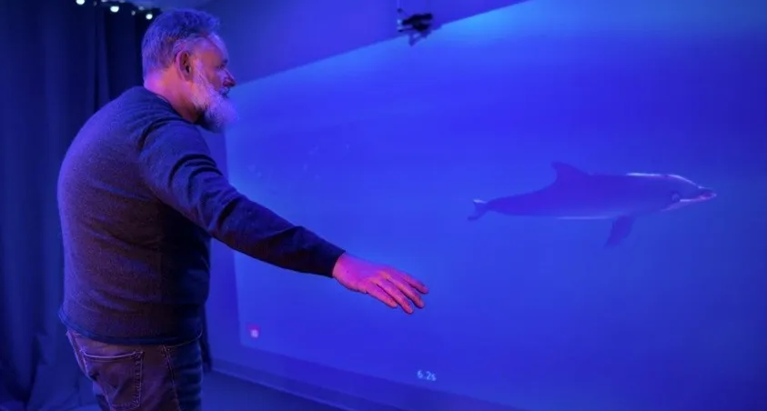 A man playing MindMaze's MindPod game.