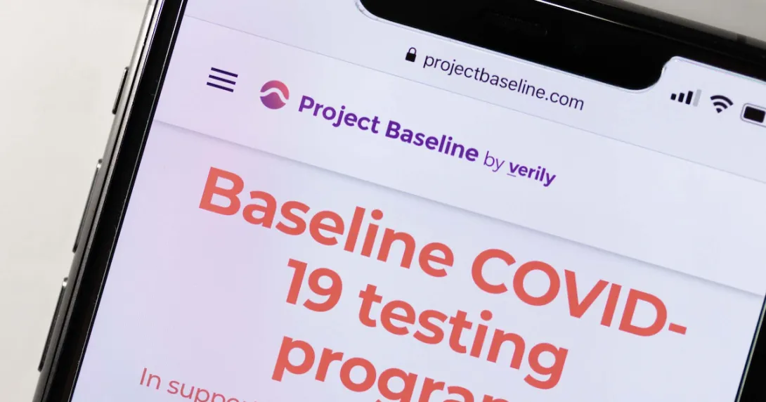 A phone showing a screenshot from Project Baseline's COVID-19 testing program.