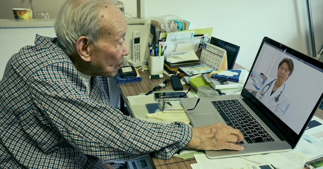 Person consulting with physician via laptop