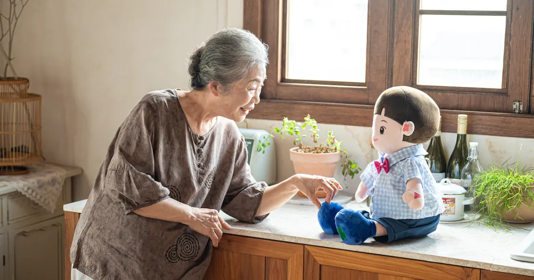 A senior individual interacting with an AI companion doll