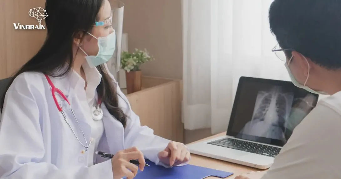 A doctor explaining to a patient some findings from their chest x-ray