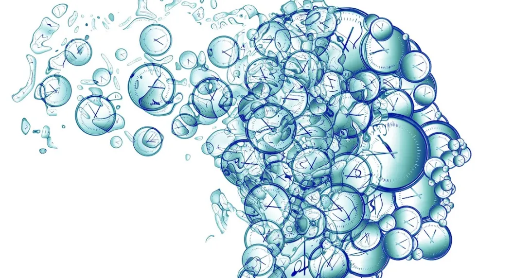 profile of a head made of clocks