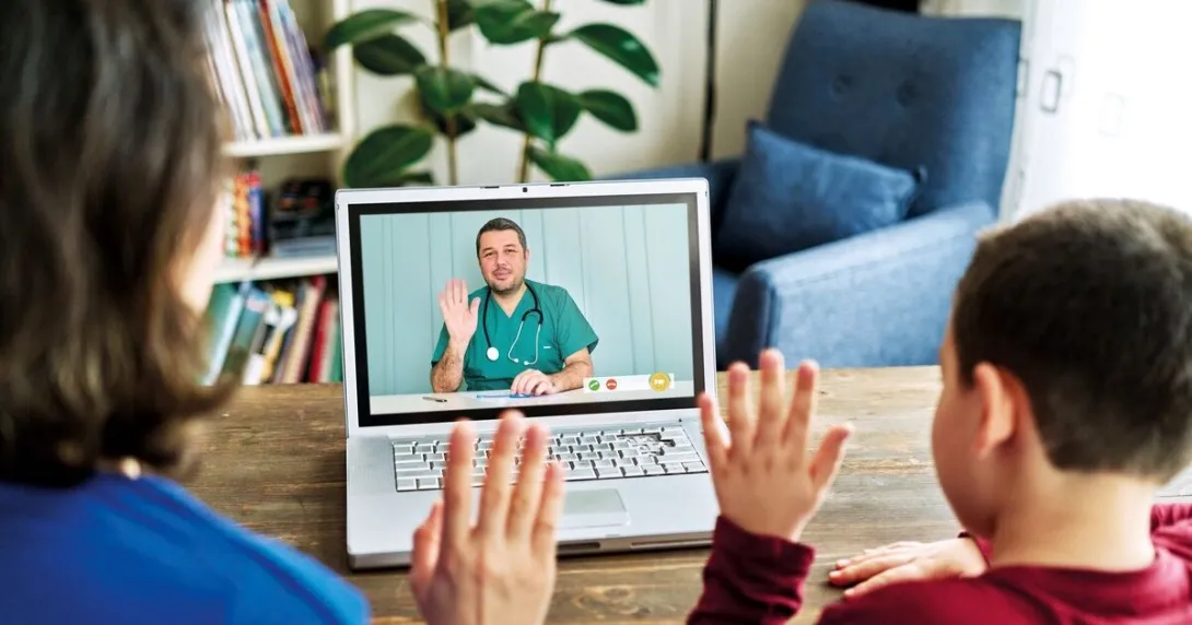 A mother and child in an online consultation with a doctor
